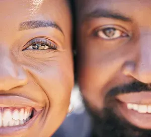Couple smiling — Invisalign candidates in Hialeah